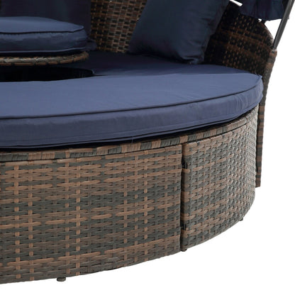 Lit de jour rond en rotin d'extérieur avec auvent et table basse relevable, canapé-lit bleu marine à assise profonde avec oreillers et coussins lavables